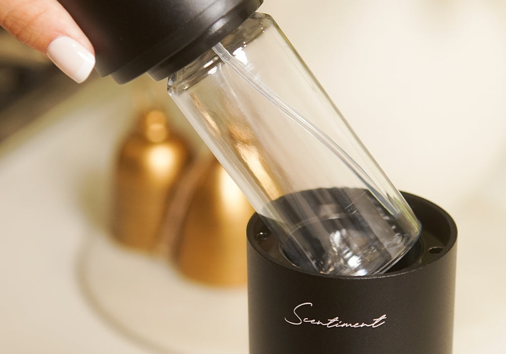 Lift up the diffusion head to reveal the fragrance vessel compartment.