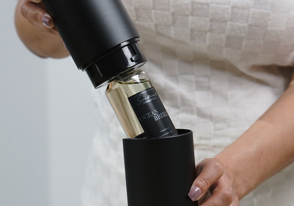 Insert the bottle back into the diffuser, ensure a tight fit by twisting clockwise.