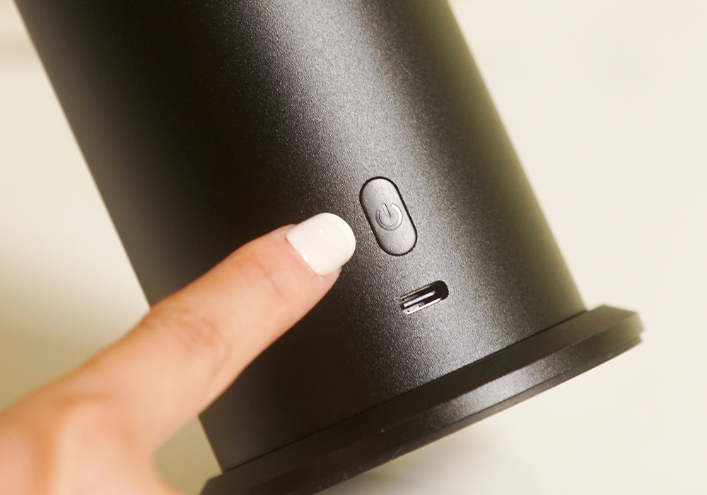 Ensure the diffuser is plugged in. Then, use the included remote control or the power button on the device to turn it on.