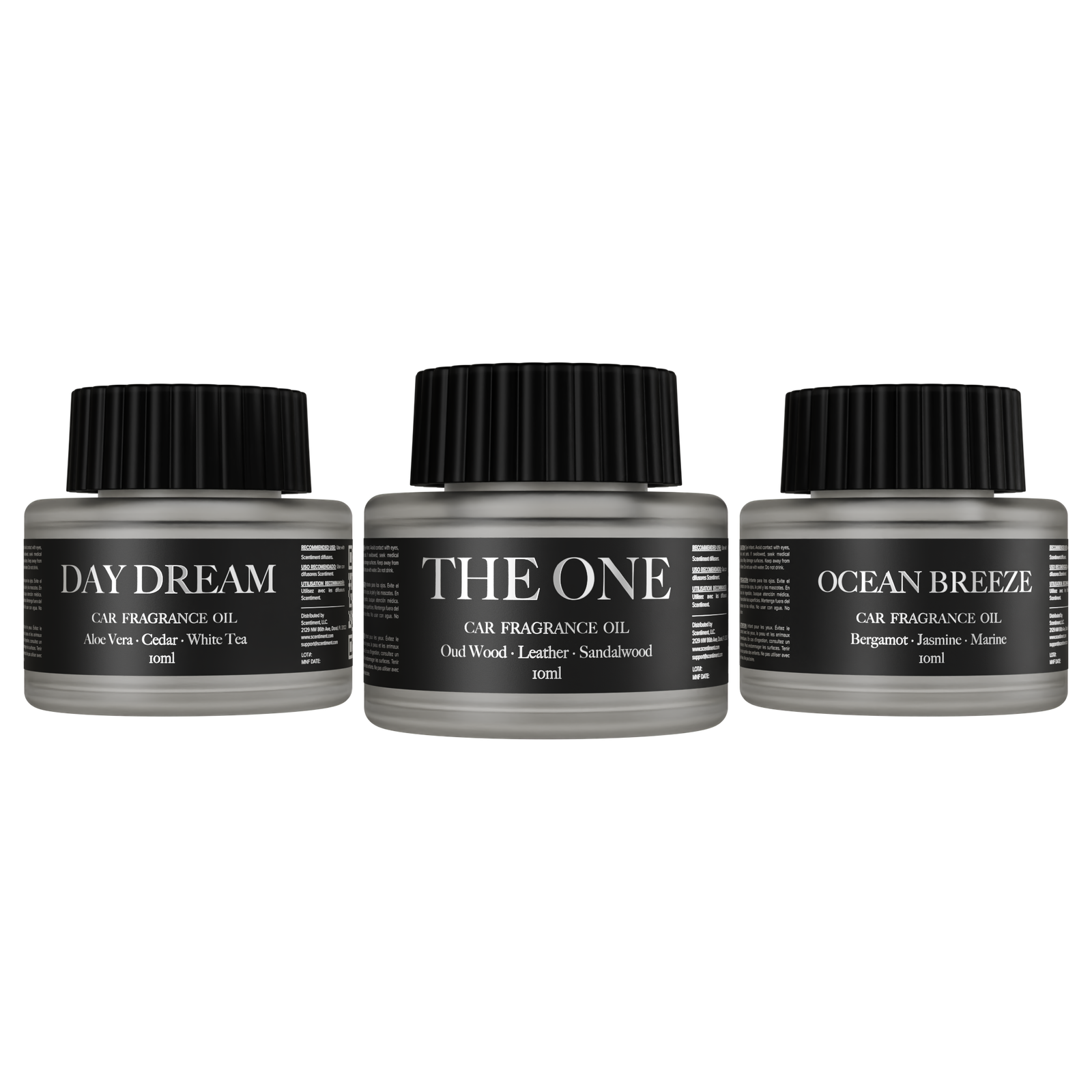 Three car fragrance oil bottles labeled 'Day Dream', 'The One', and 'Ocean Breeze' on a white background.