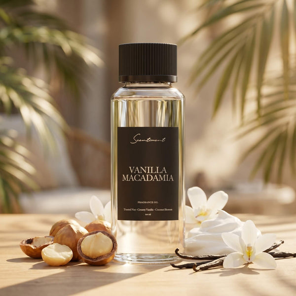 Scentiment Vanilla Macadamia diffuser fragrance oil bottle with macadamias and vanilla beans on a wooden surface.