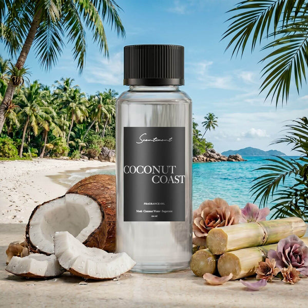 Scentiment Coconut Coast diffuser oil with coconuts, flowers, and sugarcane on a beach background